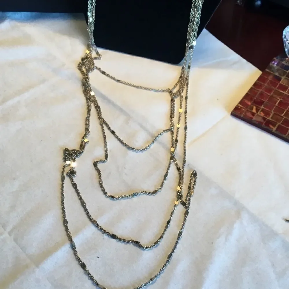 $12 or 3/$25. 5 Strand Goldtone Necklace